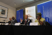 Minister of public enterprises Pravin Gordhan (centre) and Eskom chairman Jabu Mabuza (right) address the media on Eskom's supply problems at the Crowne Plaza Hotel in Rosebank, Johannesburg, on March 19 2019.