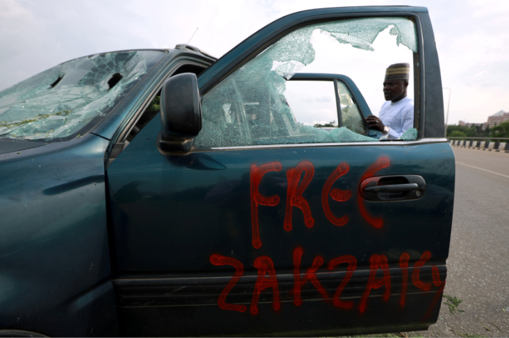 "Free Zakzaky" reads on a damaged car outside the National Assembly in Abuja, Nigeria on July 9 2019.