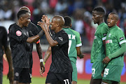 Luvuyo Memela of Orlando Pirates celebrates his goal with Kudakwashe Mahachi during the Absa Premiership match between Orlando Pirates and AmaZulu FC at Orlando Stadium on February 23, 2019 in Johannesburg, South Africa.