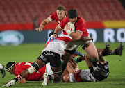 Zander Fagerson of the British & Irish Lions is tackled by Emmanuel Tshituka of the Sigma Lions.