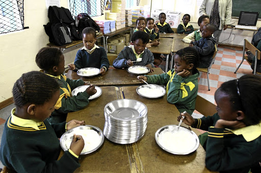 Grade 3 pupils from Mdantsane’s Vulumzi Primary School enjoy a meal as part of the education department’s feeding scheme to make up for poor nutrition. Picture: MARNÉ ERASMUS