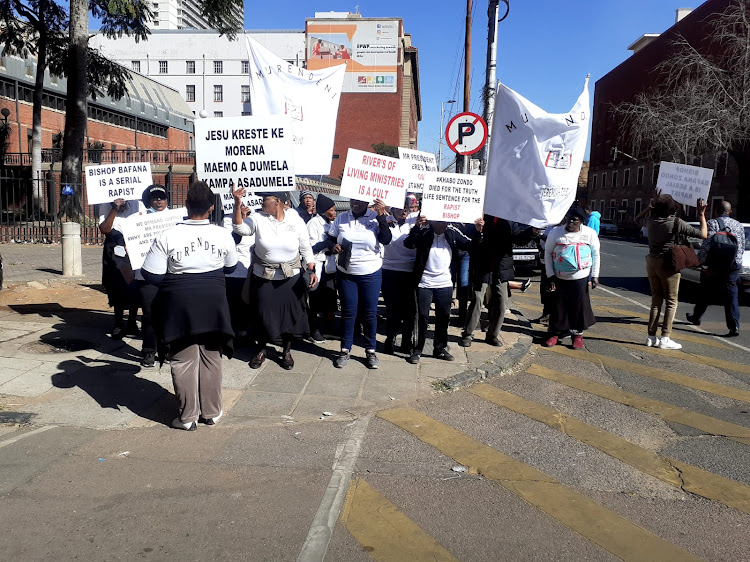 Protesters outside court on Monday ahead of Bishop Stephen Bafana Zondo's appearance.