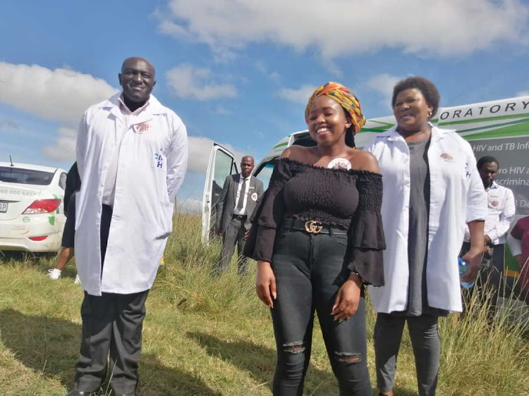 Covid-19 survivor Ncebakazi Willie with health MEC Sindiswa Gomba during the launch of the mass testing program in Fameni village in Ellitdale on Monday.