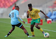 Banyana's Sibulele Cecilia Holweni, seen here dribbling Lone Gaofetoge of Botswana during the Cosafa final, had to dribble past her mom to play the game. 