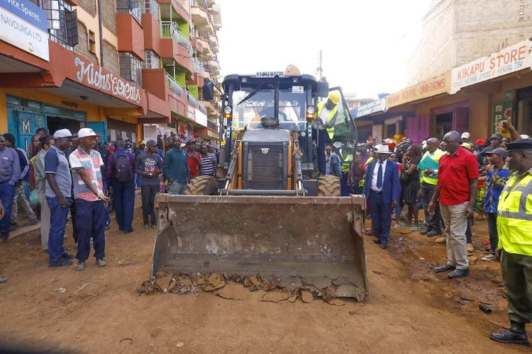 Kiambu Governor James Nyoro operats the loader during the launch of the Juja town upgrade programme on Tuesday.