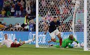 Kylian Mbappe scores France's winning goal in their World Cup Group D match against Denmark at Stadium 974 in Doha, Qatar on November 26 2022.