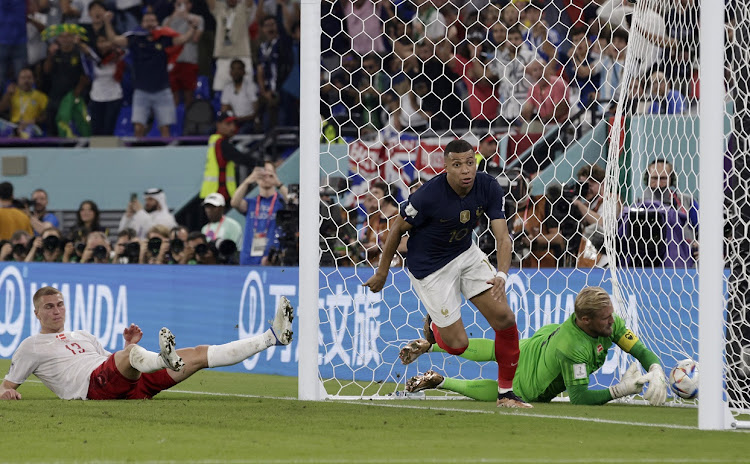 Kylian Mbappe scores France's winning goal in their World Cup Group D match against Denmark at Stadium 974 in Doha, Qatar on November 26 2022.