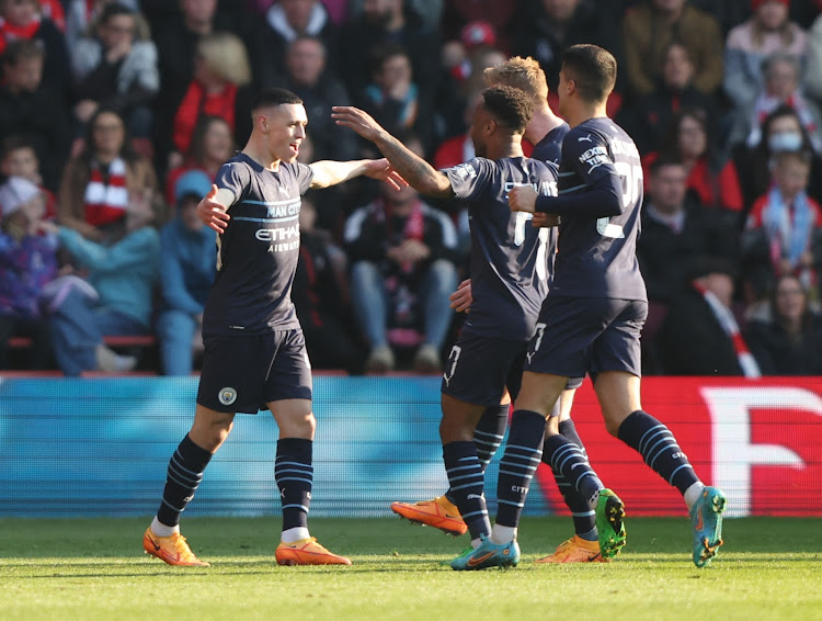 Manchester City's Phil Foden celebrates with teammates after scoring against Southampton