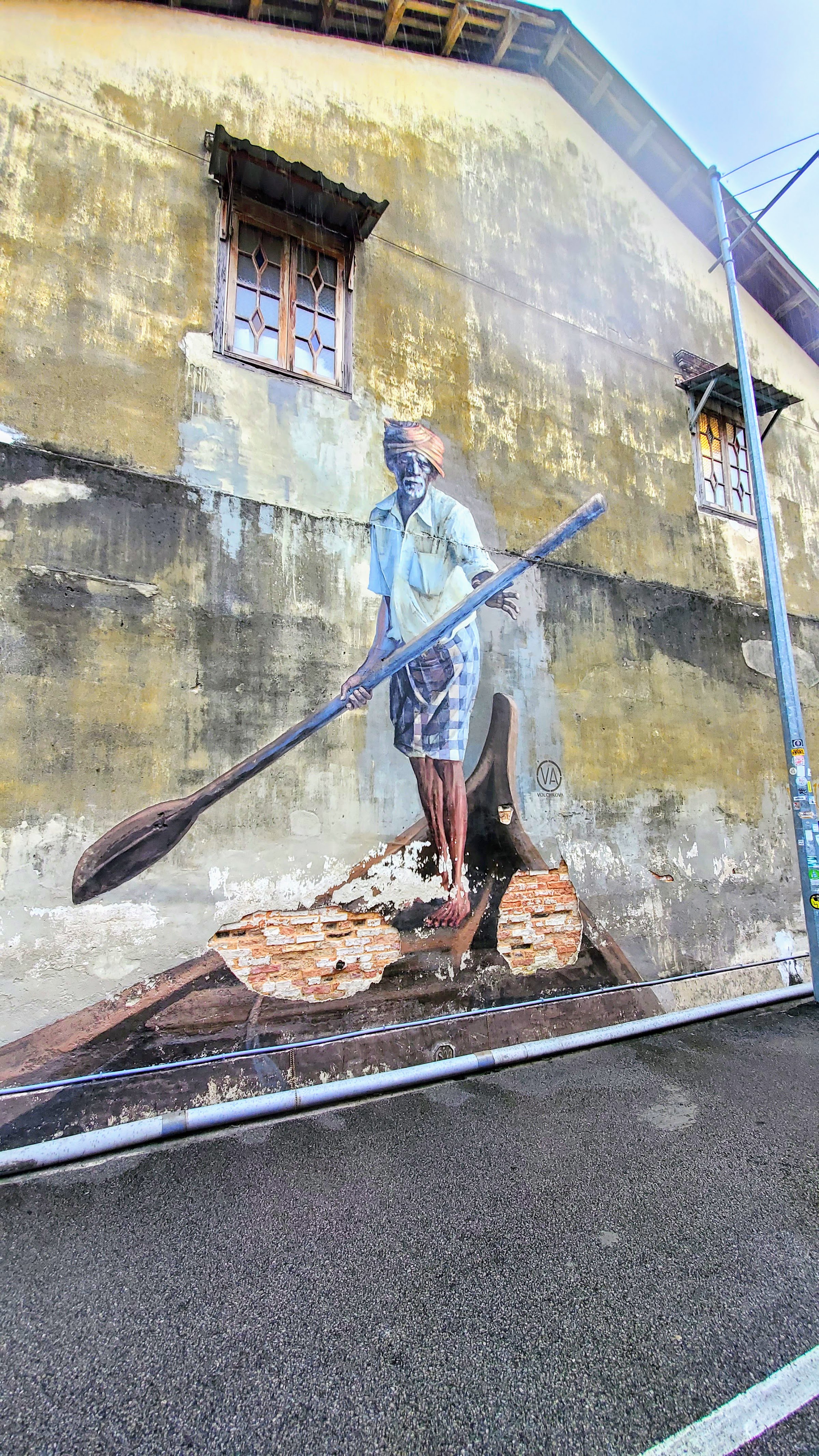 Tips on visiting George Town Street Art: The Indian Boatman painted by Russian famous street artist Julia Volchkova