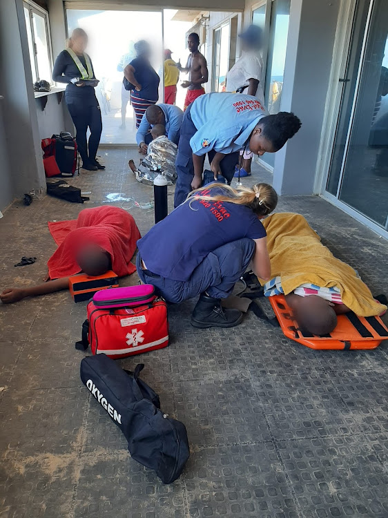 Two of the three children being stabilised by paramedics