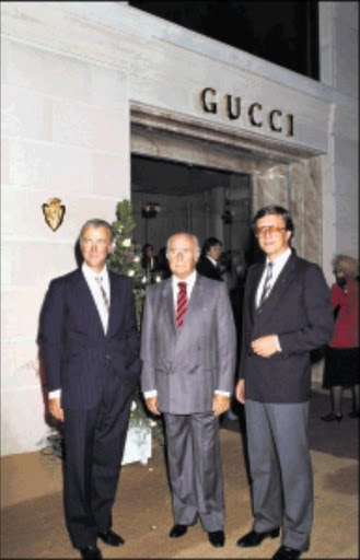 FAMILY AFFAIR: Maurizio Gucci, right, with cousins Roberto, left, and Giorgio in Paris in 1983. They later fought for control of the company