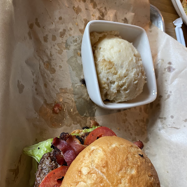 French fry residue on paper. Pretty sure they used the same bun that touched the fries. Very upset.