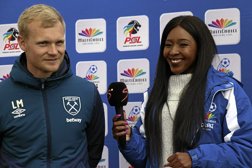 West Ham coach Liam Manning being interviewed by SuperSport presenter Lerato Phago post their match against Bloemfontein Celtic MDC side at Chadwell Heath academy. /Matthew Pentz