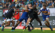 EW Viljoen of the Stormers is tackled by Louis Schreuder of the Sharks during a Super Rugby match at Newlands Stadium, Cape Town on July 7 2018.