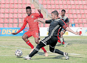 Pakiso Moeketsi of JDR Stars tries to stop Ajax Cape Town's Grant Margeman yesterday