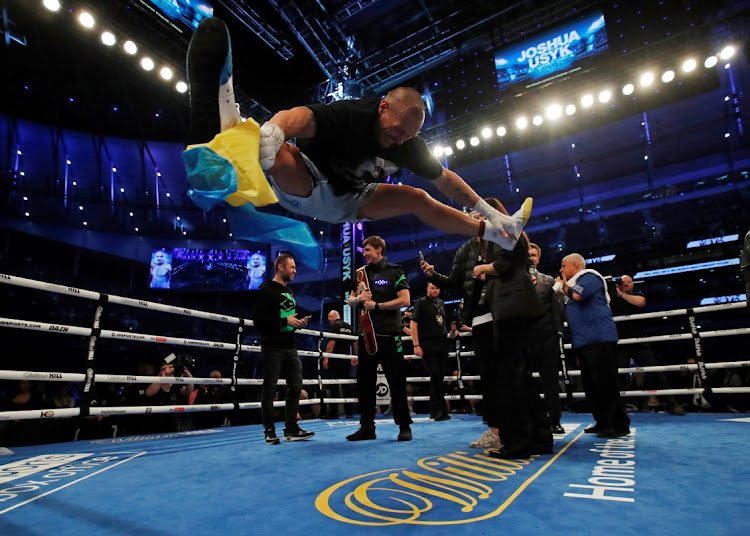 Oleksandr Usyk celebrates winning his fight against Anthony Joshua.