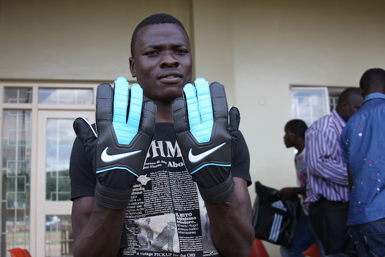 Patrick Matasi displays his Nike pair of gloves