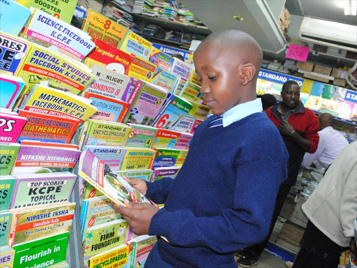 Aa pupil at Sathya Sai School in Kajiado looks for a book at the Savani’s Textbook Centre