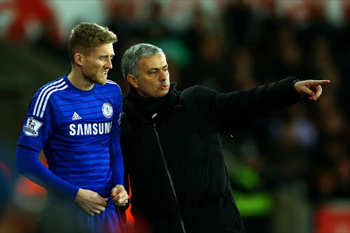 Jose Mourinho, manager of Chelsea speaks with Andre Schuerrle of Chelsea. Picture Credit: Getty Images