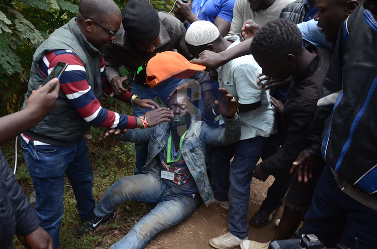 Azimio supporter faints outside the main gate as they welcome Wiper party leader Kalonzo Musyoka outside Bomas on August 15th 2022.