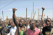 UP IN ARMS: Workers from Lonmin's Marikana Mine in Rustenburg during their illegal strike.   PHOTO: ANTONIO MUCHAVE