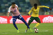 Teboho Mokoena of South Africa and Miguel Almiron of Paraguay during the Nelson Mandela Challenge match between South Africa and Paraguay at Moses Mabhida Stadium on November 20, 2018 in Durban, South Africa.