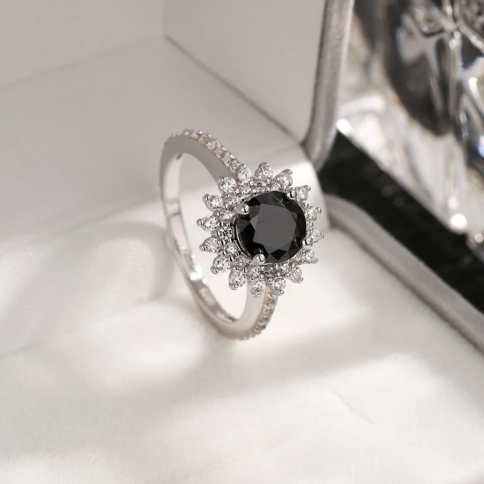 Black Zircon Flower Shaped Ring. A stunning and elegant floral design for women. Perfect for adding a touch of sophistic
