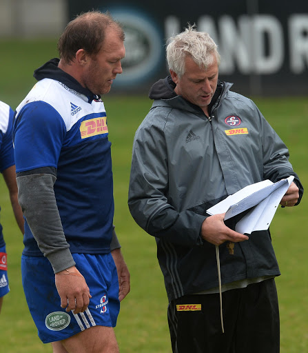 Robbie Fleck (Head Coach) chats with Schalk Burger during the DHL Stormers training session at High Performance Centre on June 27, 2016 in Cape Town, South Africa.