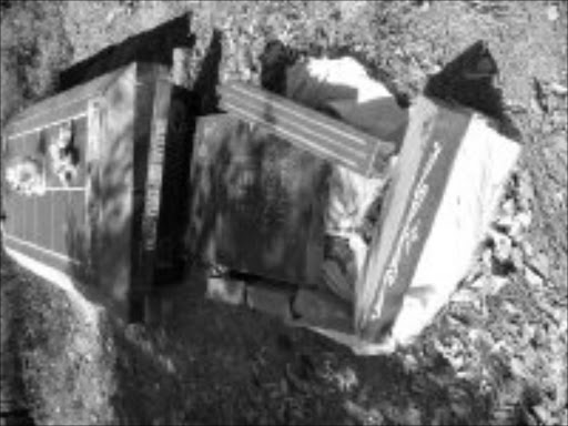 DESECRATED: One of the tombstone that have been destroyed at the cemetery at Siyandhani village. Pic. Victor Hlungwani. 13/05/2008. © Sowetan.