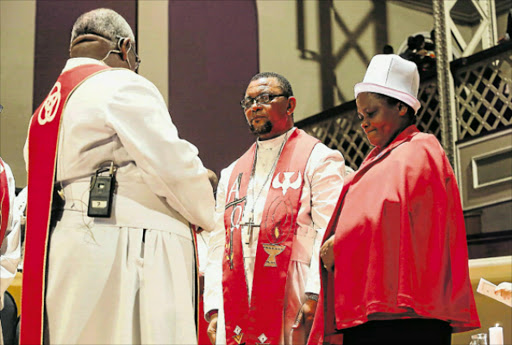 HEAVENLY DUTIES: The Induction of the new Bishop of the Methodist Church of South Africa took place at the Feather Market Hall. Pictured here is Bishop Jacob Freemantle and his wife Mandisa Freemantle on the right. To the left is presiding Bishop Zipho Siwa Picture: WERNER HILLS