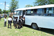 Mpongo Primary School pupils getting into one of the scholar transport buses which is cancelled in
Macleantown.