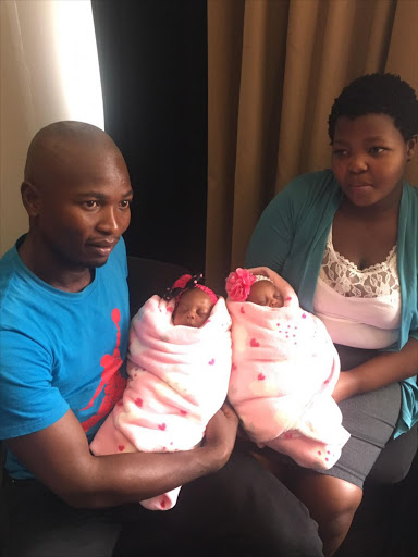 Uwenzile is held by her mother, Bongekile Simelane, and Uyihlelile is held by her father, Mbongeni Sihlongonyane.