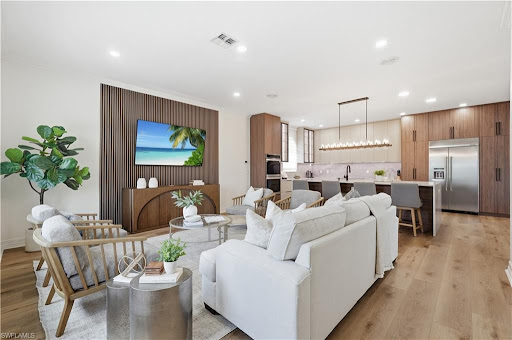 Property purchase in Fort Myers (United States) - Modern living room with open kitchen, island