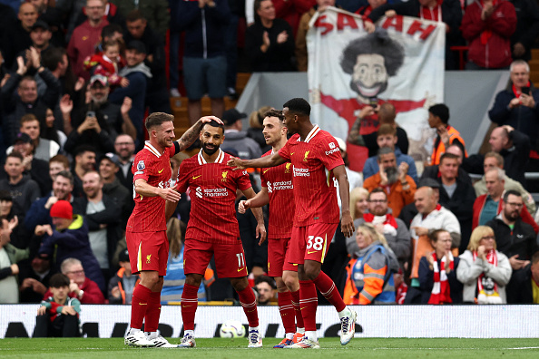 Liverpool players celebrate a goal during the English Premier League match against Brentford at Anfield in August.