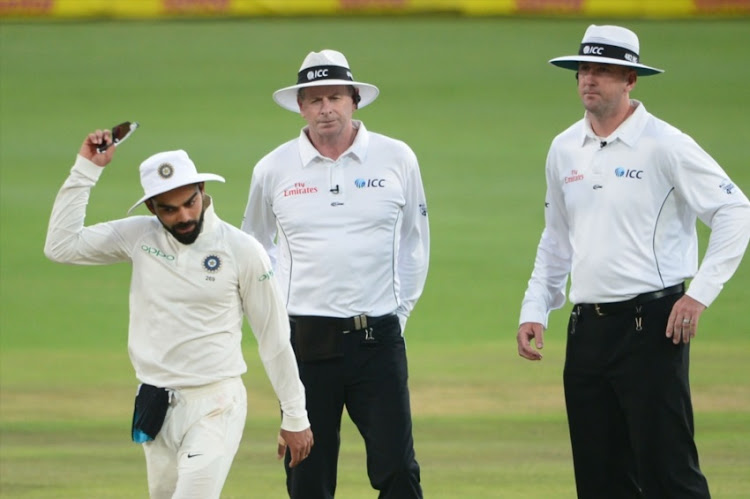 Virat Kohli of India up set with the umpires for stopping play due to bad light during day 3 of the 2nd Sunfoil Test match between South Africa and India at SuperSport Park on January 15, 2018 in Pretoria.