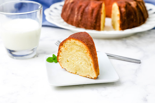 A slice of Cream Cheese Pound Cake on a plate.