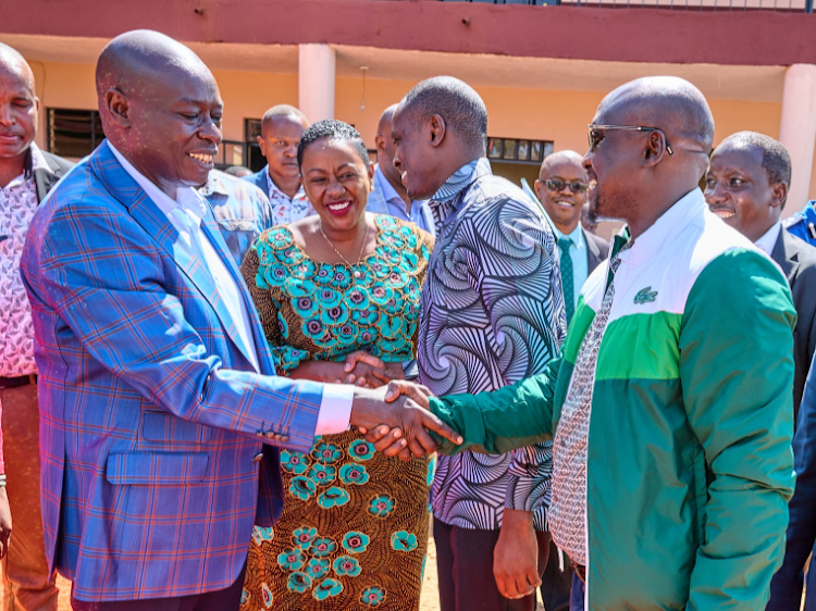 Deputy President William Ruto shaking hands with Gatanga MP Edward Muriu.