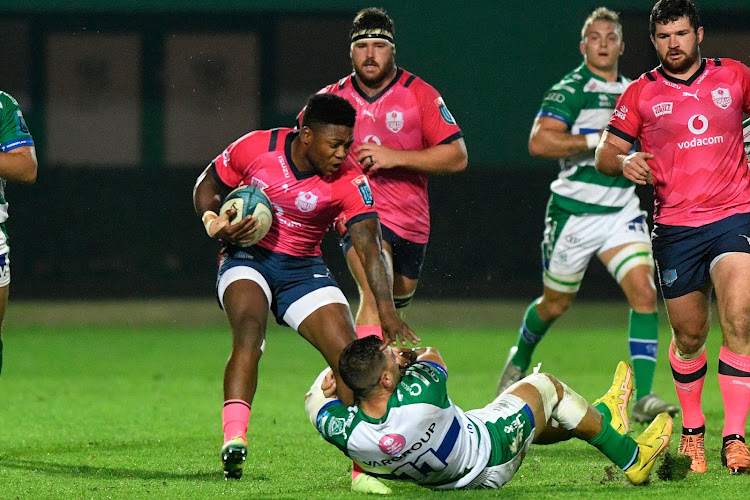 Bulls winger Wandisle Simelane challenged by Benetton's Mattia Bellini during their United Rugby Championship (URC) match at the Stadio Monigo.