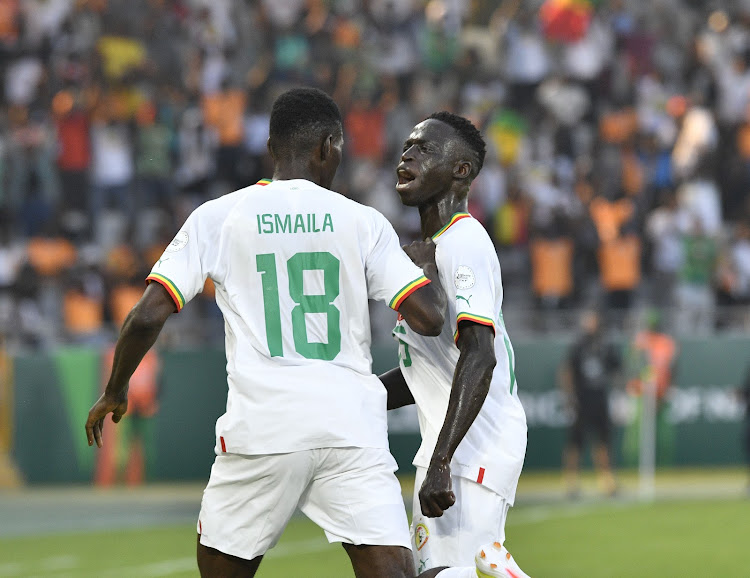 Senegal players celebrating a win in match against Cameroon.