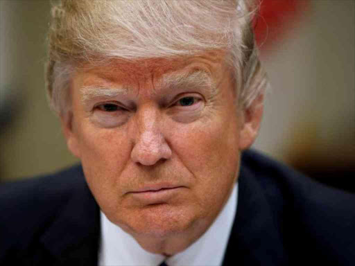 FILE PHOTO: U.S. President Donald Trump looks up while hosting a House and Senate leadership lunch at the White House in Washington, U.S. March 1, 2017. REUTERS