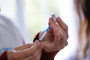 A healthcare worker prepares a dose of a vaccine against the coronavirus disease (Covid-19) in La Plata, Argentina, July 11, 2021.  