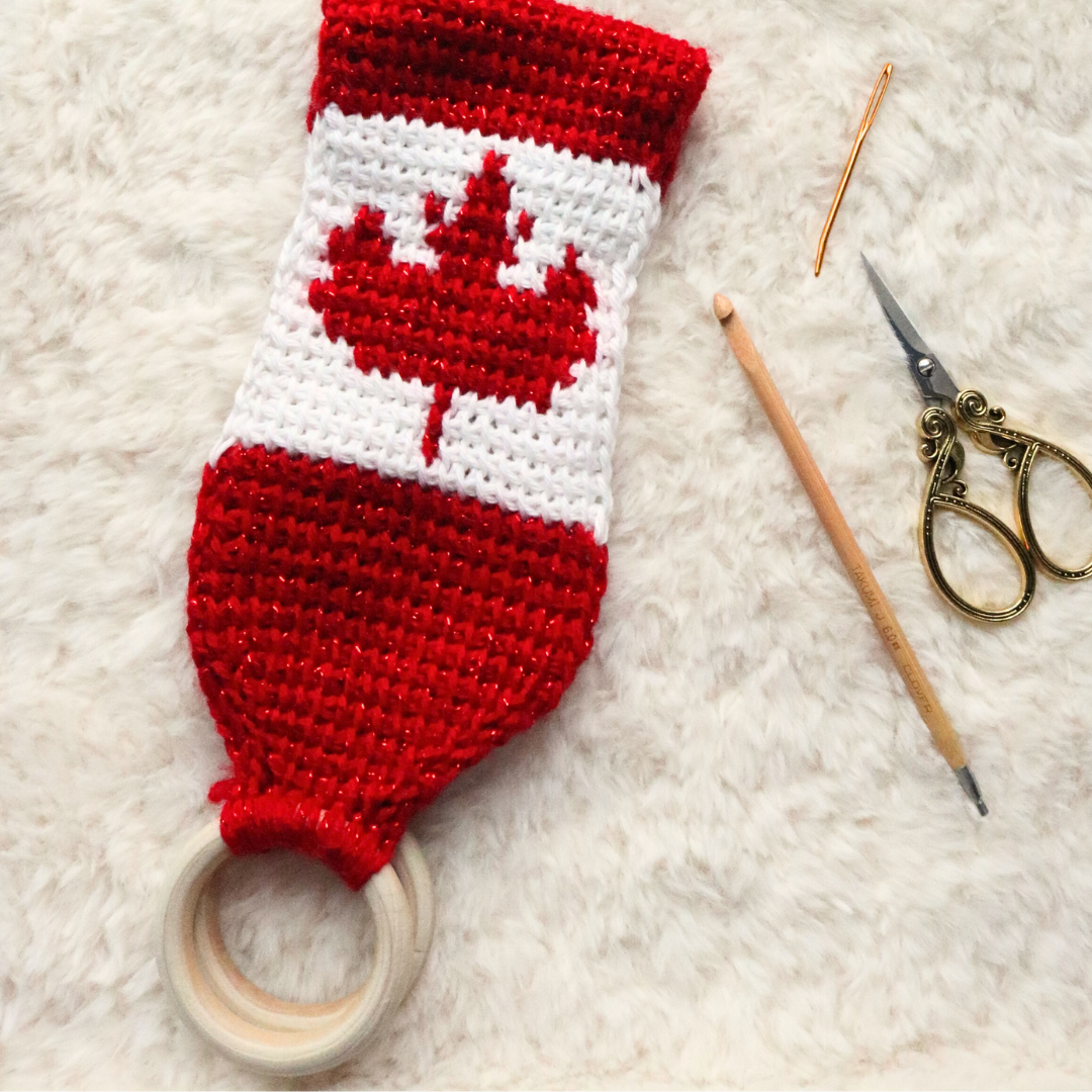 A Tunisian crochet towel topper pattern with a simple Canadian maple leaf colorwork section to practice basic Tunisian crochet stitches! 