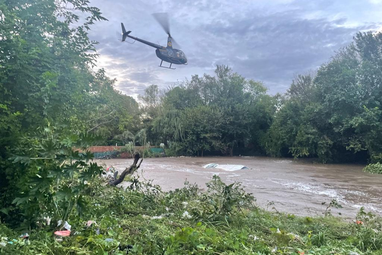 An SUV was swept into the Hennops River.