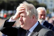 Britain's Prime Minister Boris Johnson visits Llandudno, Wales, on April 26 2021. 