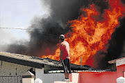 Burning shacks. File photo.