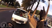 A motorcyclist filmed a dramatic stand-off with a taxi driver with his helmet-mounted camera on Sloane Street, Bryanston.