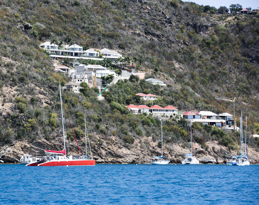 A catamaran and boats moored in Gustavia Harbour, St. Barts. 