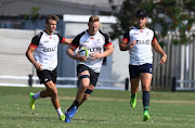 Jeremy Ward with Jean-Luc du Preez and Kobus van Wyk during the Cell C Sharks training session at Growthpoint Kings Park on May 08, 2017 in Durban, South Africa. 