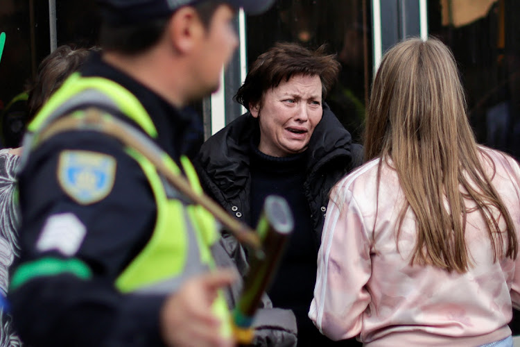 A Ukrainian woman evacuee from Mariupol reacts after arriving at a registration centre for internally displaced people, in Zaporizhzhia, Ukraine, May 3 2022. Picture: UESLEI MARCELINO/REUTERS