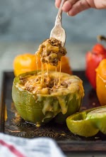 Cheesy Enchilada Stuffed Peppers was pinched from <a href="https://www.thecookierookie.com/cheesy-enchilada-stuffed-peppers/" target="_blank" rel="noopener">www.thecookierookie.com.</a>